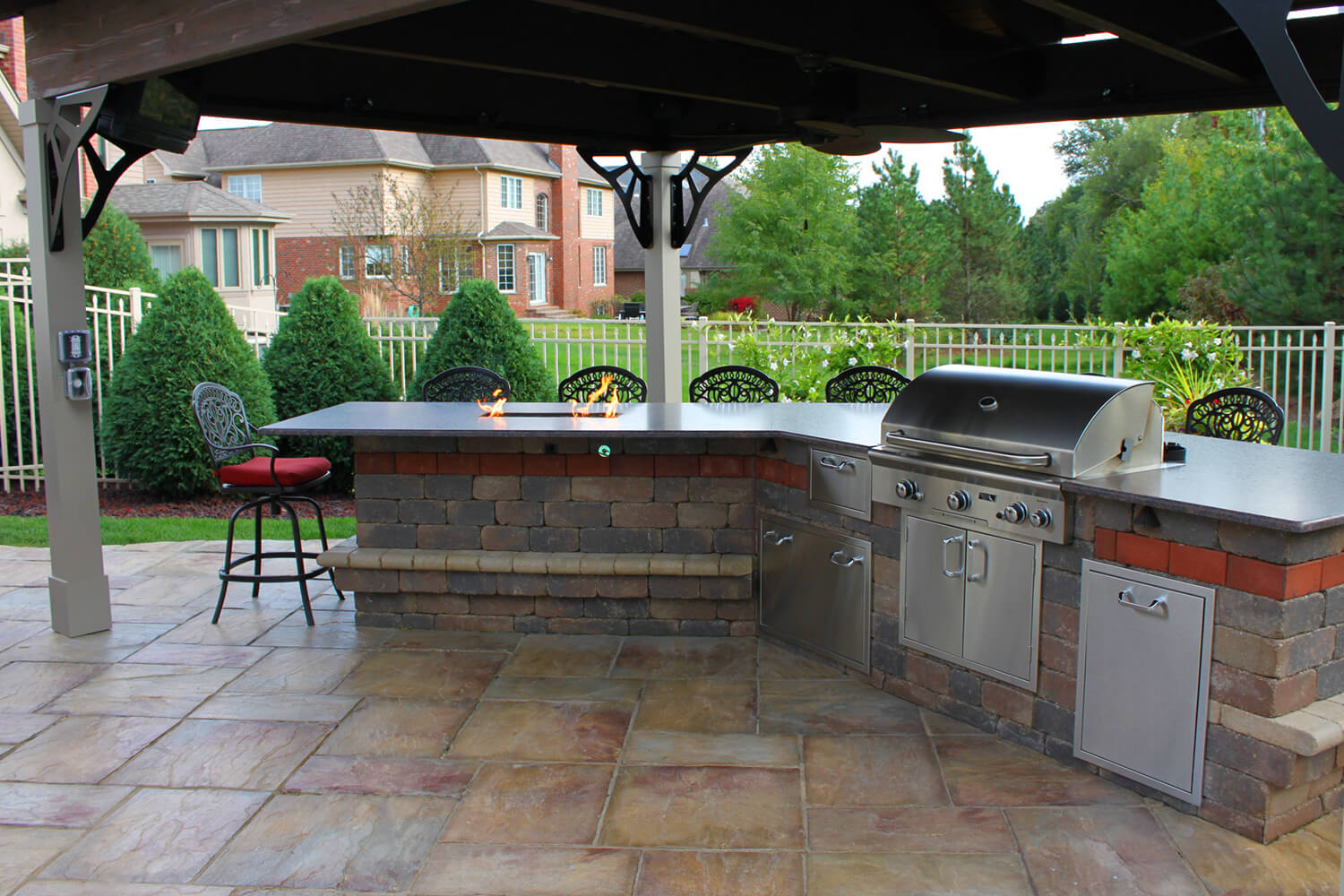 Outdoor Kitchen, Pergola, and Fire Feature by A Touch of Green