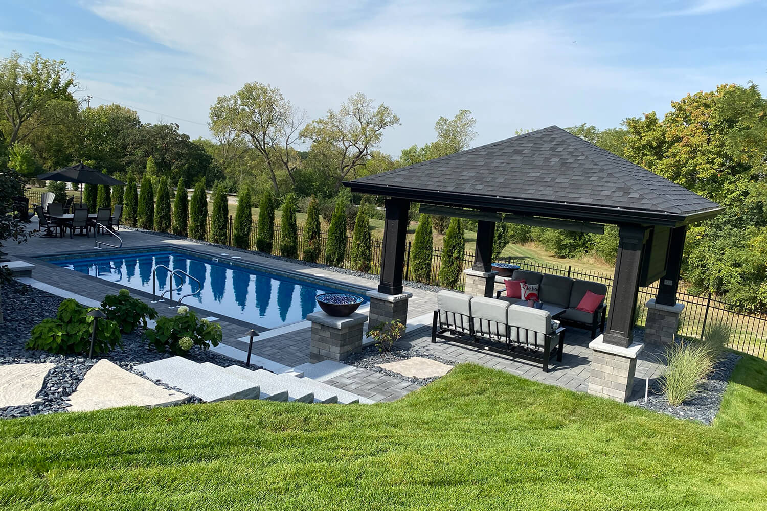 Design Transformation with Pergola, Paver Pool Deck, and Landscape Design by A Touch of Green