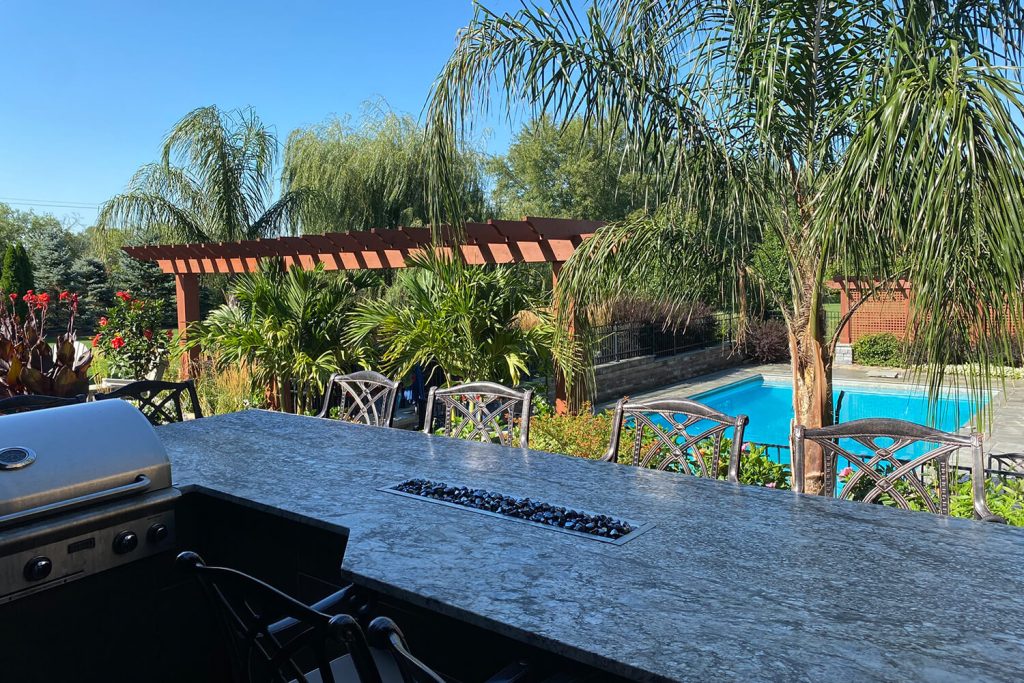 Paver Pool Deck, Pergola, and Landscape Design by A Touch of Green