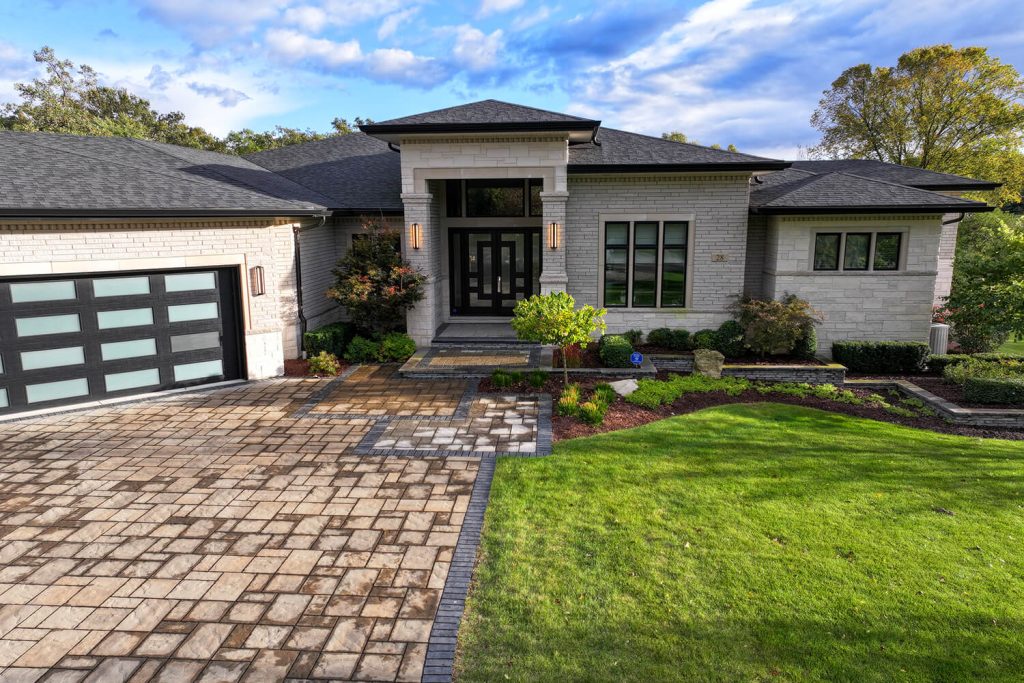 Paver driveway and landscape design by A Touch of Green
