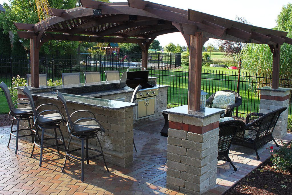 Outdoor Kitchen, Pergola, and Landscape Design by A Touch of Green