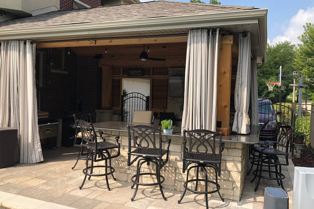 Outdoor Kitchen, Pergola, and Landscape Design by A Touch of Green
