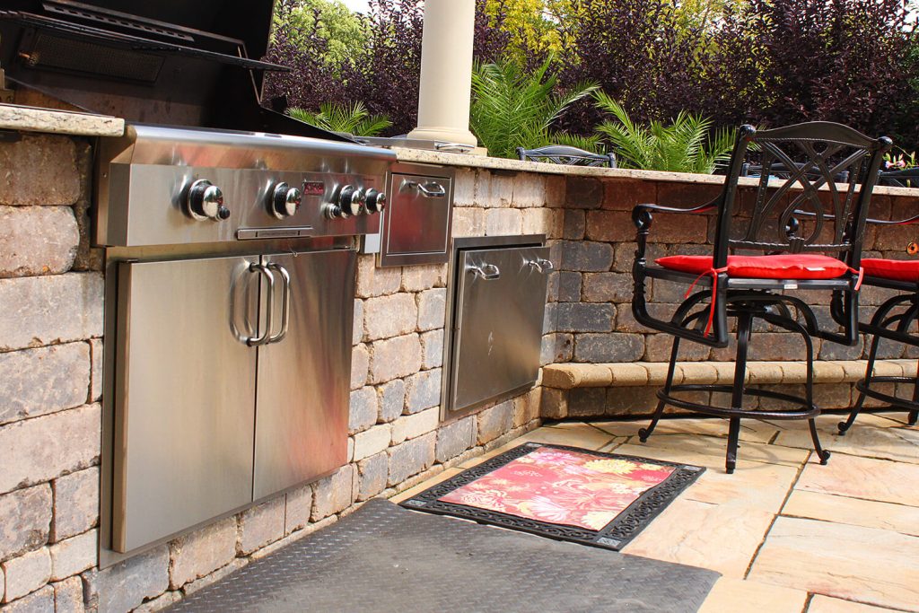 Outdoor Kitchen, Pavers, and Landscape Design by A Touch of Green