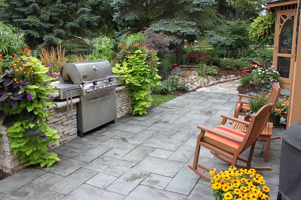 Outdoor Kitchen, Pavers, and Landscape Design by A Touch of Green