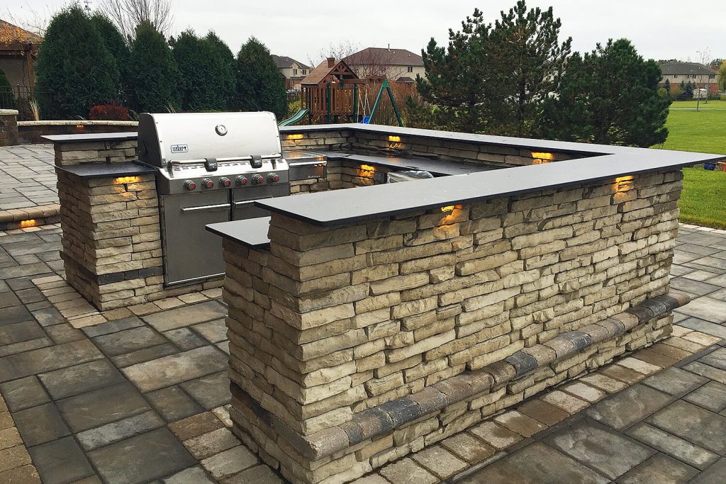 Outdoor Kitchen, Pavers, and Landscape Design by A Touch of Green
