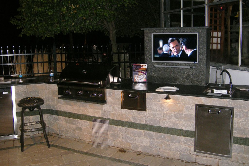 Outdoor Kitchen, Pavers, and Landscape Design by A Touch of Green