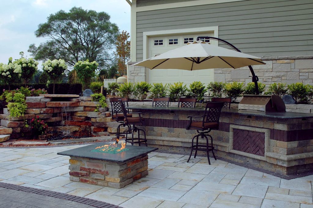 Outdoor Kitchen, Fire Feature, and Landscape Design by A Touch of Green