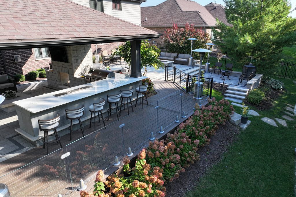 Patio and Outdoor Kitchen by A Touch of Green