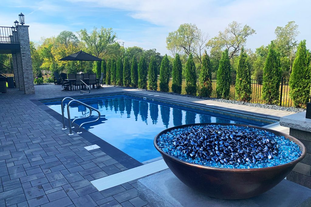 Pool Deck, Fire Features, and Landscape Design by A Touch of Green