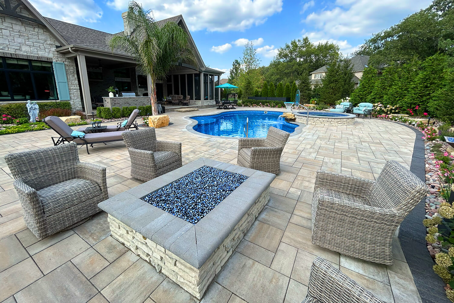 Paver Pool Deck, Fire Feature, and Landscape Design by A Touch of Green