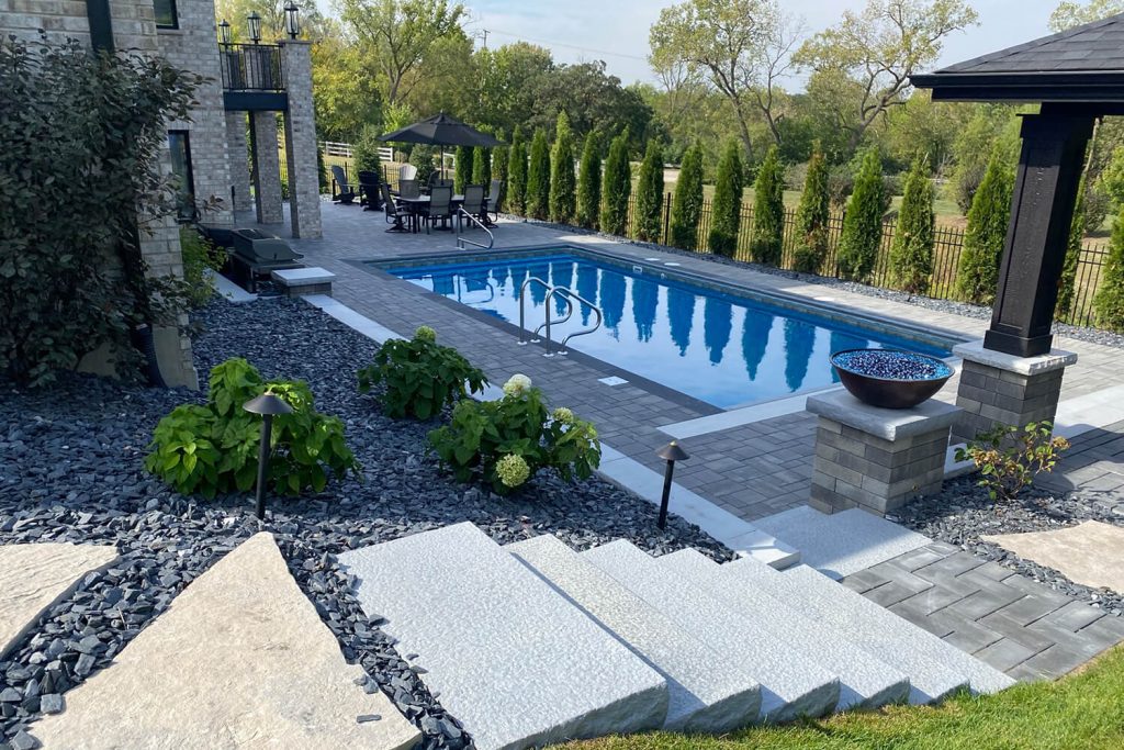Paver Pool Patio and Landscape Design by A Touch of Green